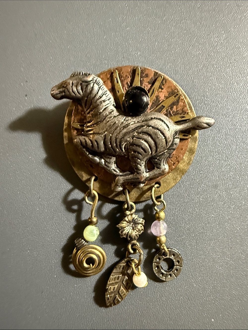 antiqued brass and copper zebra brooch, a black faux onyx stone